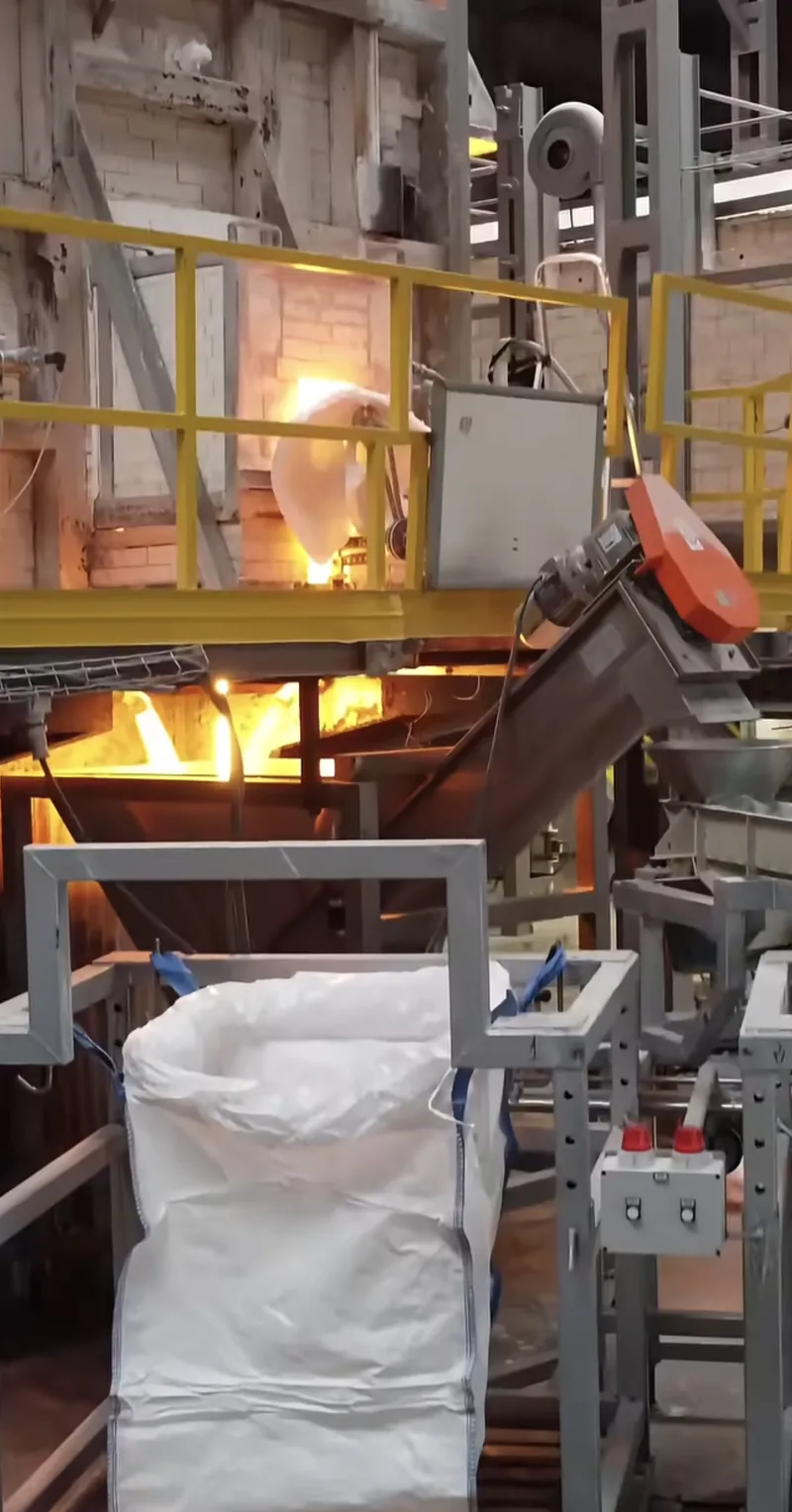 Molten glass pouring from kiln at INCA facility